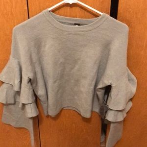 Cropped sweater with accent sleeves